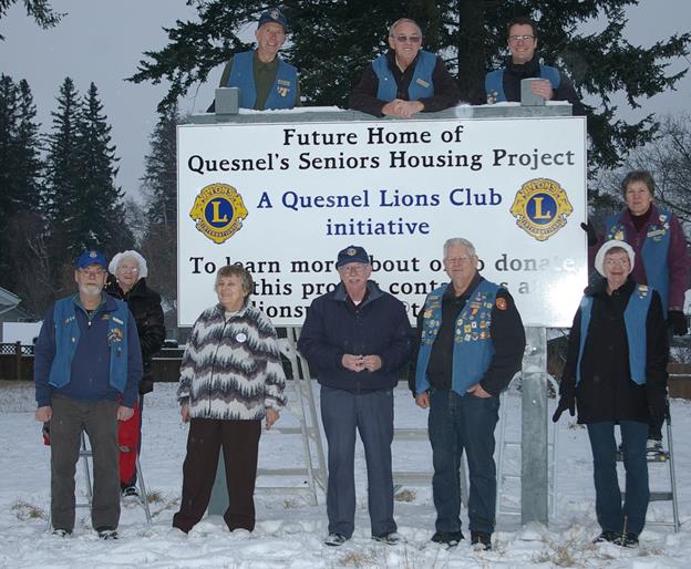 December 10, 2012: a group of Quesnel Lions celebrate the new sign on our property